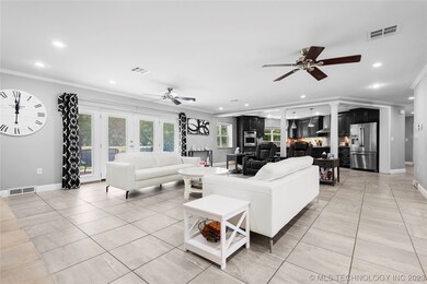 Living area open to kitchen and dining.