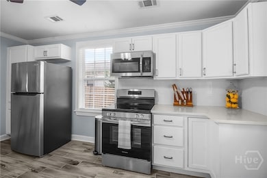 Open kitchen concept allows ample space for meal preparation and effortless entertaining