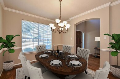 Formal dining has plenty of room for your large furniture as depicted in this staged photo.