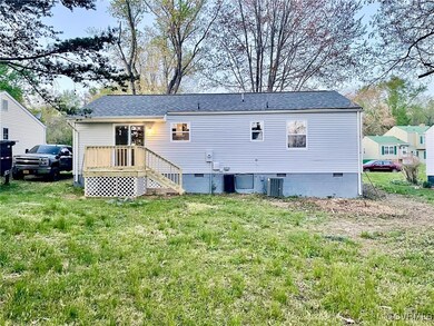 Back of property with crawl space, cooling unit, a