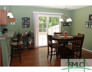 Dining Room. Dining overlooks patio and deck and g