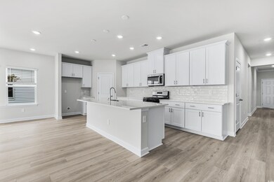 Kitchen featuring appliances with stainless steel 