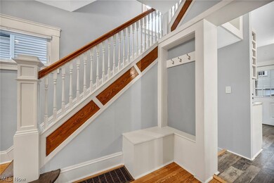 Staircase with hardwood / wood-style flooring