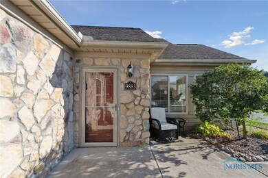 STONE ENTRY WITH NEW STORM DOOR AND BUILT IN SCREE