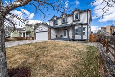 Traditional home featuring a front yard, concrete 
