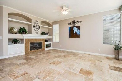 Large family room has built in shelving, stacked s