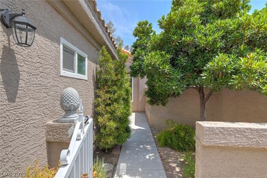 Gated courtyard area with patio trees providing sh