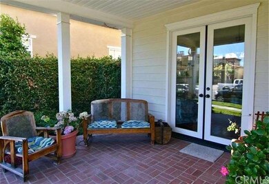 Bricked, covered front porch.