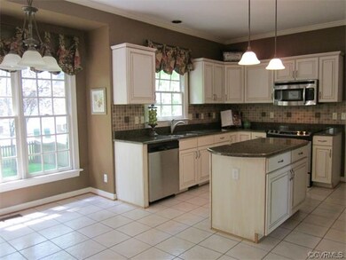 Warm & inviting Kitchen! Tiled floors, granite top
