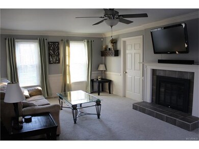 Living room, new fixtures and paneling with chair rail, new carpet