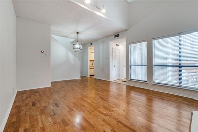 Empty room featuring hardwood / wood-style floorin