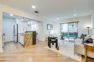 Living room featuring sink and light wood-type flooring