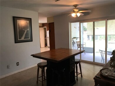 Dining Room looking into kitchen with screened pat