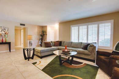 LIVING ROOM WITH PLANTATION SHUTTERS