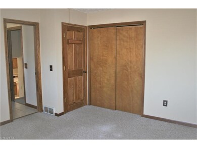 Master bedroom, bath off open doorway