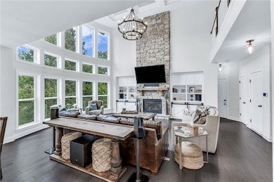 Floor to ceiling stone fireplace, custom built-ins