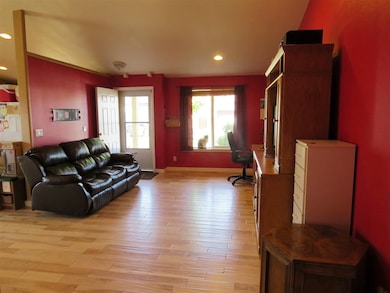 Features wide-plank handscraped hardwood flooring