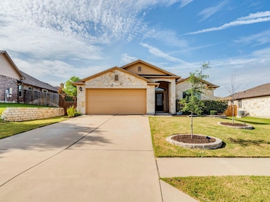 View of front facade with concrete driveway, an a