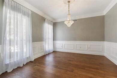 Dining room off foyer and kitchen.