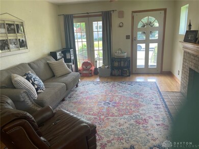 The spacious living room has French doors to the patio.