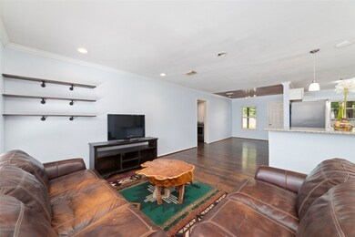 Spacious open-concept layout ideal for entertaining and everyday comfort. Crown mouldings accent wood floors and are accented by recessed can lighting.