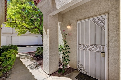 Property entrance featuring stucco siding