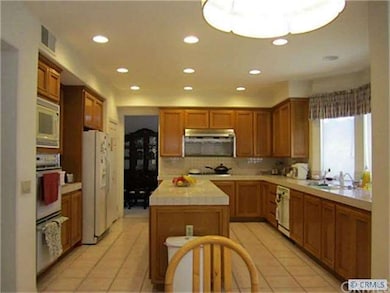 Kitchen with recessed lights and center island