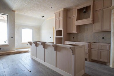 Kitchen with a kitchen island, crown molding, a ki