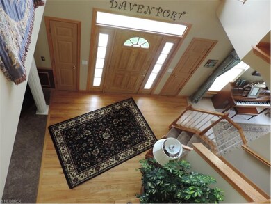 Entry greets guests in this two story foyer with h
