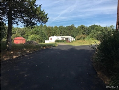 View from street featuring driveway and a  view