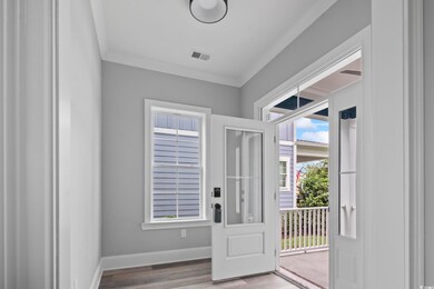 Entryway with light hardwood / wood-style floors a