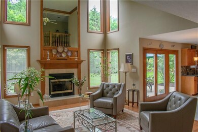 2-story family room with fireplace and hardwood fl