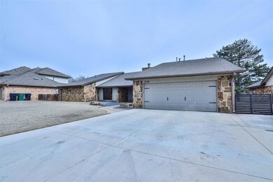 View of front of property with extended driveway