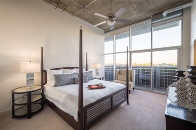 The generously sized bedroom serves as a tranquil