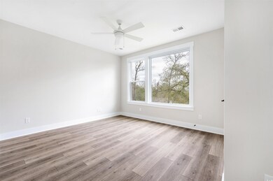 Empty room with light hardwood / wood-style floori