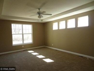 Master Bedroom with many windows.  Light and Brigh