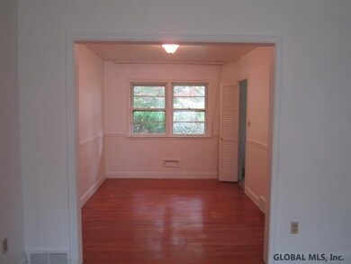Hardwood floors & adjacent to kitchen.