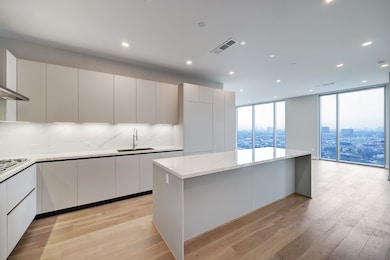 This modern kitchen features sleek cabinetry, a la