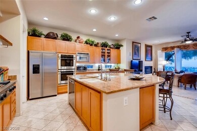 Kitchen features SS appliances and a grand island