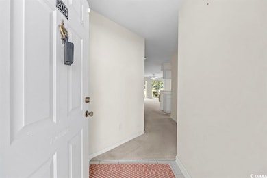 Hall with light colored carpet