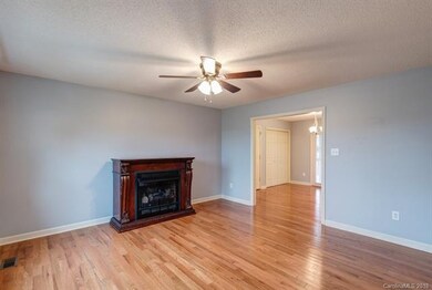 Enter the cozy Living Room with propane fireplace - adjacent to Dining area.