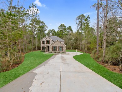 BEAUTIFUL CUSTOM HOME 2 STORY HOME SITS ON A WOODED 1 ACRE LOT.
