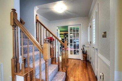 Foyer with new carpet on steps