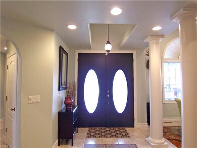 Beautiful Columned Tiled Double Door Foyer