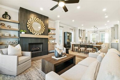 A spacious living area with a gas fireplace create