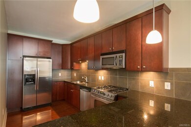 Kitchen with breakfast bar and granite counters