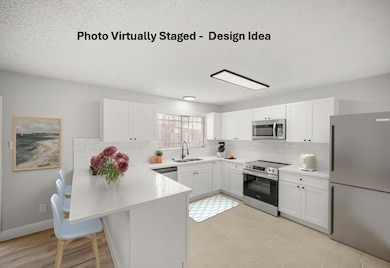 The kitchen is spacious and overlooks a family/din