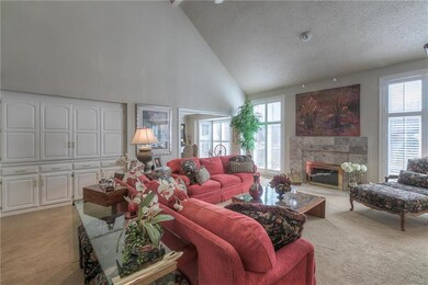Great Room with beautiful fireplace and lots of bu