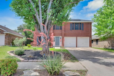 View of front of property featuring concrete driv