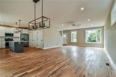Open Floor plan with many windows and lots of natural light